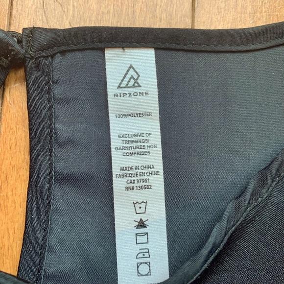 Shiny black peplum top! Loose fitting. Ripzone brand. Size small/medium. - Picture 5 of 5